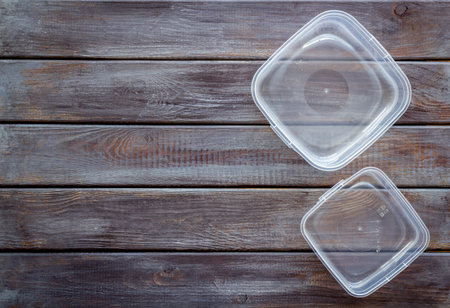 empty lunch box for food to go on wooden background top view space for text