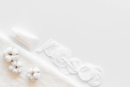 Hygiene cotton swabs, pads and cream for pattern on white background top view mock upの写真素材