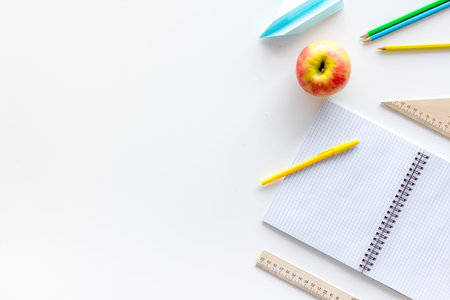 Education mockup with pupils stationery and textbook on white background top view