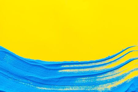 Modern design for blor with blue sand texture on yellow background top view mock upの写真素材