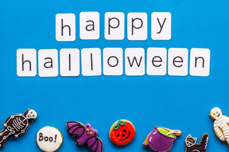 Happy halloween copy and cookies for decoration on blue background top viewの写真素材