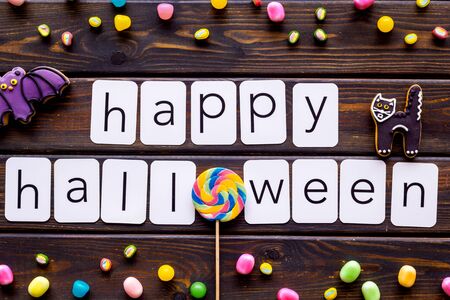 Happy halloween copy and cookies for decoration on wooden background top viewの写真素材