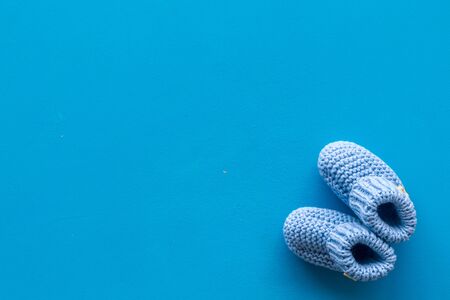 Cute baby booties for boy on blue background top view copyspaceの写真素材
