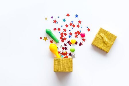 Box filled with party objects on white background top viewの写真素材