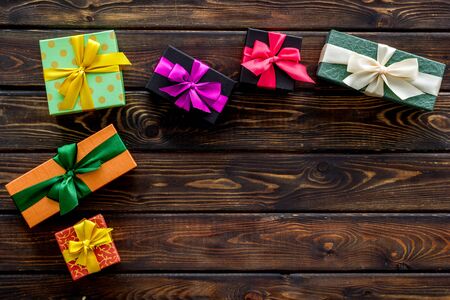 presents in boxes frame on wooden background top view copyspaceの写真素材
