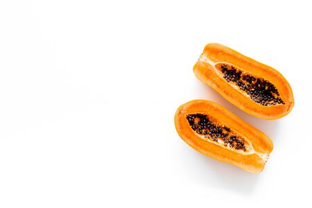 Ripe juicy papaya. Two halfs of papaya top view.の写真素材