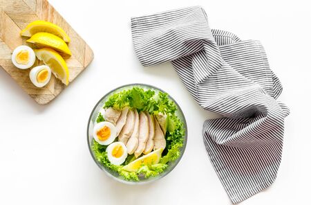 Healthy dinner in bowl on white background top viewの写真素材