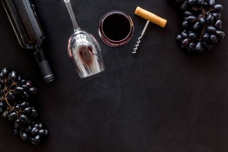 Composition with wine bottle on black background top view space for text