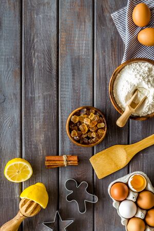 Cooking for Christmas or New Year dinner. Dough ingredients on dark wooden background top view copy spaceの写真素材