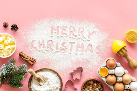 Merry Christmas written on pink baking background top viewの写真素材
