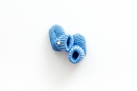 Booties for newborn boy on white background top view mock upの写真素材