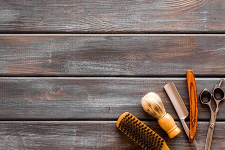 Mens shaving accessories on dark wooden background top view space for textの写真素材