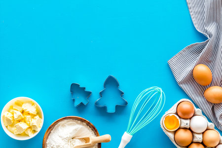 Baking ingredients on blue background top view space for text
