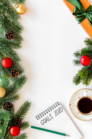 Planning New Year 2020. Notebook with goals on white background top view space for text mockup