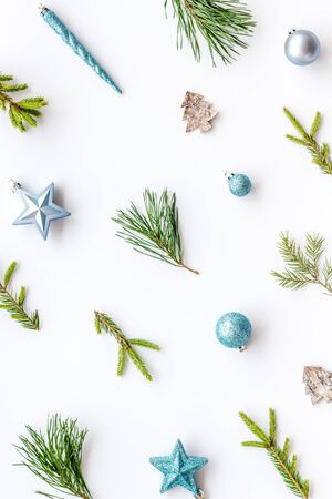 New Year background with fir branches and festive decoration on white table top view flat lay patternの写真素材