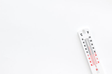 Weather thermometer on white background top view.