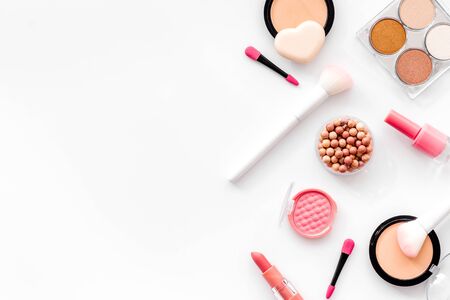 Makeup concept. Frame with decorative cosmetics and brushes on white background top view copy spaceの写真素材