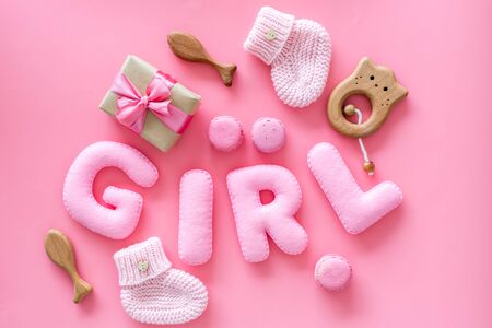 Girlss birthday concept. Pink baby set with gift box on pink backgound top viewの写真素材