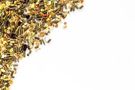 Pet food for rodents like rabbits, guinea pigs, hamsters on white background top view.の写真素材