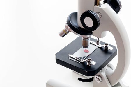 Blood testing. Samples viewing under microscope on white  top view space for textの写真素材