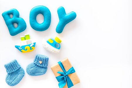 Boys birthday concept. Set in blue colors with gift box on white backgound top view frame space for textの写真素材