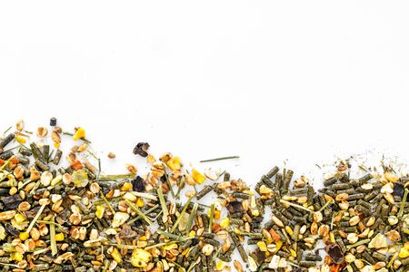 Pet food for rodents like rabbits, guinea pigs, hamsters on white background top view copy space frameの写真素材