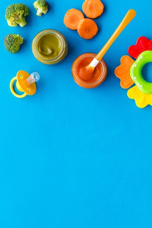 Vegetable and fruits puree for feed babies on blue background top view.の写真素材