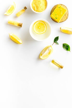 Lemon cosmetics. Cleansing tonic and handmade soap on white background top view.の写真素材