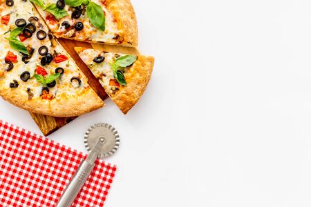 Homemade pizza on white background top view.の写真素材