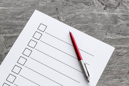 Empty check list ready to fill on grey background top viewの写真素材