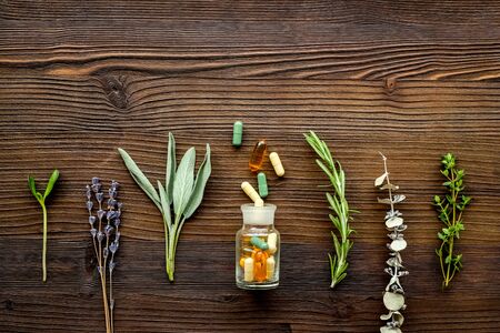 Herbal formulations for health care on dark wooden background top view pattern copy spaceの写真素材
