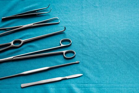Instruments for plastic surgery on blue background flat layの写真素材