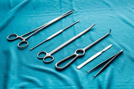 Instruments for plastic surgery on blue background flat lay patternの写真素材