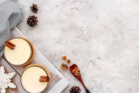 Eggnog - cute New Year composition with alcoholic drink on grey background top view frame copy spaceの写真素材