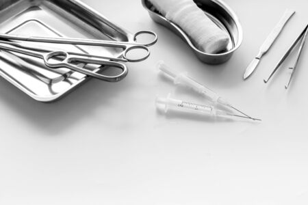 Plastic surgery instruments and tools with bandage and ampoulie on white background copy spaceの写真素材