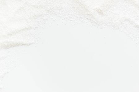 Washing powder scattered on white background top view frame copy spaceの写真素材