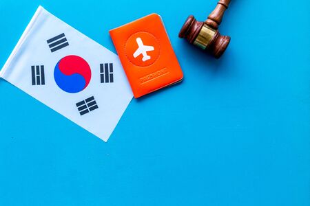 Korean flag near passport and judge hammer on blueの写真素材