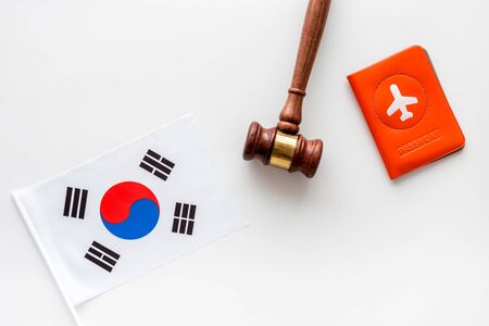 Korean flag near passport and judge hammer on whiteの写真素材