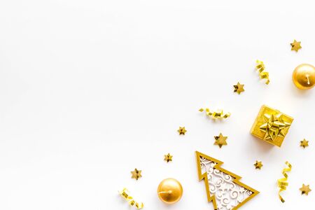 New Year symbols - tree, present box, confetti - on white background top-down frame.の写真素材