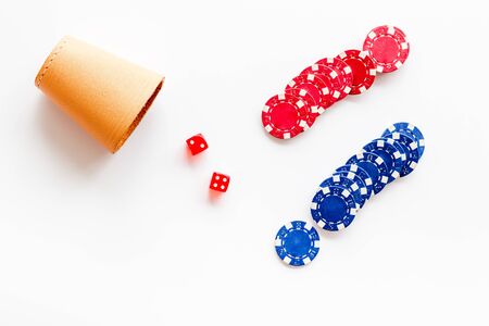 Poker concept. Chips, dices, cup for dice on white background top-downの写真素材