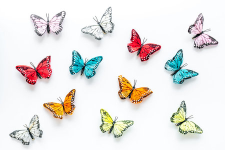 Multicolored tropical butterflies on white background top-down pattern.の写真素材