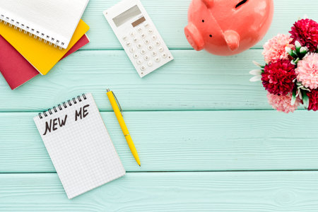 New me - planning self-development in New Year - notebook on cute hipster's green wooden desk...