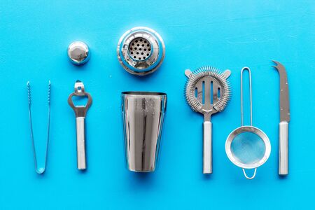 Bartender equipment set with shaker and stainer on blue background top-down pattern.の写真素材