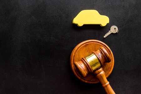 Car credit debt concept with judge gavel on black background top-down copy spaceの写真素材