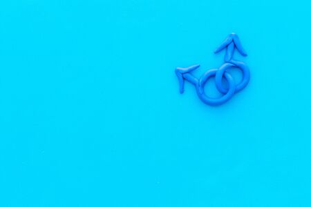 Male Mars symbol on blue background top-down copy spaceの写真素材