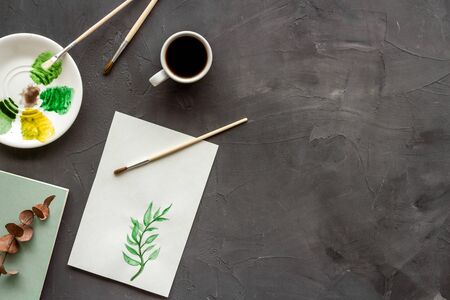 Drawing plants. Brushes and picture on grey background top-down copy space