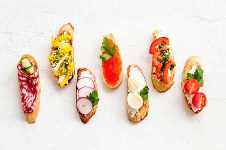 Sandwiches assorti pattern on white background top-down.の写真素材