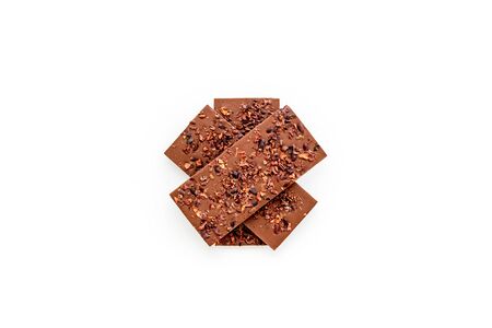 Chocolate - stack of dark bars - on white background top-down.