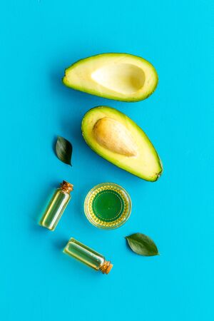Avocado oil - ingredient for cosmetics - on blue background top-downの写真素材