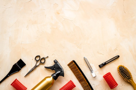 Beauty saloon concept. Hairdresser accessories pattern on beige background top-down frame copy spaceの写真素材
